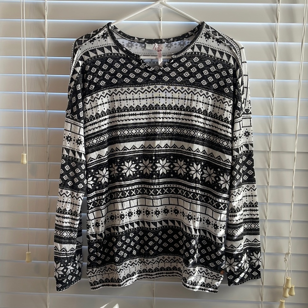 The brand is Matilda Jane. The size is a 16. Black and white top.